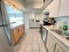 Kitchen featuring stainless appliances, granite countertops, and ample cabinet space at 3122 Scranton St, Port Charlotte, FL 33952