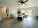 Cozy living room with tile floors and a comfortable sectional sofa with natural light from the window at 3122 Scranton St, Port Charlotte, FL 33952