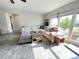 Bright living room with large windows, tile flooring, and a comfortable sectional sofa at 3122 Scranton St, Port Charlotte, FL 33952