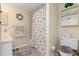 Cozy bathroom features tiled floors, a seashell themed shower curtain, and decorative accents at 315 Holly Rd, Venice, FL 34293