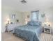 Bedroom features light green walls, and wicker furniture, lamps, and headboard at 315 Holly Rd, Venice, FL 34293
