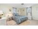 Bedroom featuring light green walls, and wicker furniture, lamps, and headboard at 315 Holly Rd, Venice, FL 34293