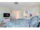 Comfortable bedroom with light green walls, and wicker furniture and lamps at 315 Holly Rd, Venice, FL 34293