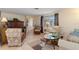 Cozy living room with neutral decor, tile flooring, and ample natural light at 315 Holly Rd, Venice, FL 34293