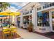 Charming street view with outdoor cafe seating and local shops, perfect for a leisurely day at 315 Holly Rd, Venice, FL 34293