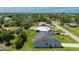 The aerial view showcases the verdant landscaping and manicured yards in this neighborhood at 3302 Palm Dr, Punta Gorda, FL 33950