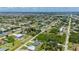 High angle showcases a lovely neighborhood with canals, highlighting the property's proximity to both nature and urban amenities at 3302 Palm Dr, Punta Gorda, FL 33950