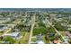 A birds-eye view shows the property situated in a quiet residential area, bordered by lush landscapes and canals at 3302 Palm Dr, Punta Gorda, FL 33950