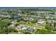 Aerial view of a charming neighborhood with serene canals and lush landscapes, showcasing the property's desirable location at 3302 Palm Dr, Punta Gorda, FL 33950