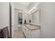 Bathroom with granite countertop vanity and access to the dining area at 3302 Palm Dr, Punta Gorda, FL 33950