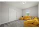 Bedroom with a large yellow sectional sofa and a window at 3302 Palm Dr, Punta Gorda, FL 33950