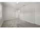Empty bedroom with carpet, a window, and white trim at 3302 Palm Dr, Punta Gorda, FL 33950