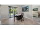 Cozy dining area with tile floors offers easy access to the outdoors at 3302 Palm Dr, Punta Gorda, FL 33950