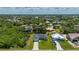 This beautifully landscaped property features lush greenery and a well-maintained lawn at 3302 Palm Dr, Punta Gorda, FL 33950