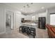 Bright kitchen has stainless steel appliances and a granite island with seating at 3302 Palm Dr, Punta Gorda, FL 33950
