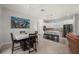 Bright kitchen and dining area showcases white cabinetry and granite countertops at 3302 Palm Dr, Punta Gorda, FL 33950