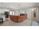 Open-concept living room boasts a large sectional, neutral tones, and tile floors at 3302 Palm Dr, Punta Gorda, FL 33950