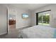 Relaxing main bedroom with a mounted TV and sliding glass doors to the patio at 3302 Palm Dr, Punta Gorda, FL 33950