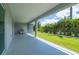 Large screened lanai with a barbecue grill and view of the backyard at 3302 Palm Dr, Punta Gorda, FL 33950