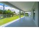 Screened lanai providing expansive views of the lush backyard and landscaping at 3302 Palm Dr, Punta Gorda, FL 33950