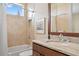 Bathroom features a granite countertop, modern fixtures, and a shower-tub combo at 3353 Sandpiper Dr, Punta Gorda, FL 33950