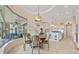 Bright breakfast nook featuring a view of the water and seamless transition to modern kitchen space at 3353 Sandpiper Dr, Punta Gorda, FL 33950