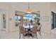 Breakfast nook with large bay window offering views of the water and screened-in pool at 3353 Sandpiper Dr, Punta Gorda, FL 33950