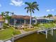 Lovely waterfront home with a pool, boat dock, and beautifully manicured landscaping at 3353 Sandpiper Dr, Punta Gorda, FL 33950