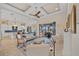 Bright living room featuring coffered ceilings and elegant furniture, with easy access to the lanai at 3353 Sandpiper Dr, Punta Gorda, FL 33950