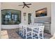 Charming outdoor kitchen features a full-sized bar, grill, and outdoor dining space, perfect for entertaining guests at 3353 Sandpiper Dr, Punta Gorda, FL 33950