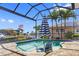 Beautiful pool area with waterfront views, surrounded by lush landscaping, perfect for relaxation and entertaining at 3353 Sandpiper Dr, Punta Gorda, FL 33950