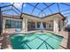 Gorgeous pool and lanai area perfect for entertaining, featuring a sparkling pool and seamless indoor-outdoor flow at 3353 Sandpiper Dr, Punta Gorda, FL 33950