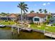 Beautiful waterfront home boasts a private boat dock, screened lanai, and lush landscaping for serene outdoor living at 3353 Sandpiper Dr, Punta Gorda, FL 33950