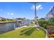 Scenic waterfront view featuring well-manicured landscaping and a private boat dock along the tranquil canal at 3353 Sandpiper Dr, Punta Gorda, FL 33950