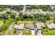 Aerial view of the property showcasing the pool, canal, and proximity to surrounding homes at 336 Waterside St, Port Charlotte, FL 33954