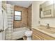 Cozy bathroom with shower and tub combination with charming fixtures at 336 Waterside St, Port Charlotte, FL 33954