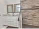 Bright bathroom with double sink vanity, stone countertop, and gorgeous tiled shower at 336 Waterside St, Port Charlotte, FL 33954