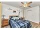 Inviting bedroom with ceiling fan, warm decor, and ample natural light at 336 Waterside St, Port Charlotte, FL 33954