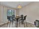 Cozy dining area with modern furniture and a view of the screened patio and backyard at 336 Waterside St, Port Charlotte, FL 33954