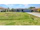 Charming single-story home with a well-manicured lawn and screened entryway at 336 Waterside St, Port Charlotte, FL 33954
