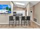 Contemporary kitchen with white cabinetry, granite countertops, and a breakfast bar at 336 Waterside St, Port Charlotte, FL 33954