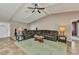 Open living room with high ceilings and large windows, showcasing a comfy leather sectional sofa at 336 Waterside St, Port Charlotte, FL 33954
