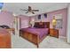 Charming main bedroom with a wooden bed frame, soft carpet, and an ensuite bathroom at 336 Waterside St, Port Charlotte, FL 33954