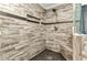 Close up of the tile shower featuring a rain shower head and built in bench at 336 Waterside St, Port Charlotte, FL 33954