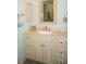 A serene bathroom vanity offers ample storage beneath a light countertop with a matching framed mirror at 3398 Tripoli Blvd, Punta Gorda, FL 33950