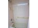 Bathroom featuring tub with hand rails and tiled wall at 3398 Tripoli Blvd, Punta Gorda, FL 33950