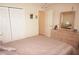 Inviting bedroom featuring a queen-sized bed, closet, and dresser, offering ample storage at 3398 Tripoli Blvd, Punta Gorda, FL 33950