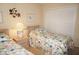 Bright bedroom with two beds, neutral walls, and plantation shutters at 3398 Tripoli Blvd, Punta Gorda, FL 33950