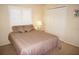 Cozy bedroom featuring a queen bed, shutters, and neutral color scheme for a relaxing atmosphere at 3398 Tripoli Blvd, Punta Gorda, FL 33950