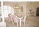 Dining room featuring a glass table with pink chairs, complemented by a hutch and window at 3398 Tripoli Blvd, Punta Gorda, FL 33950